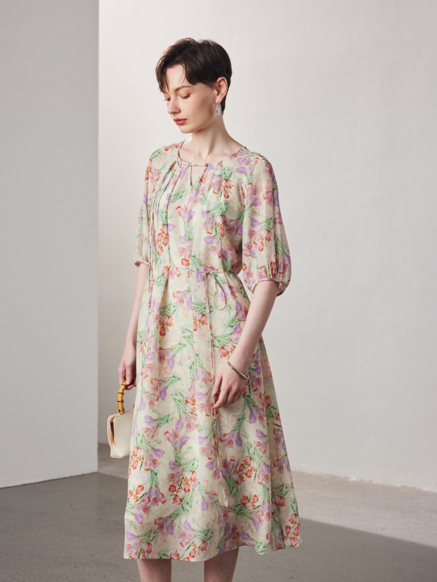 A woman wearing a floral dress.