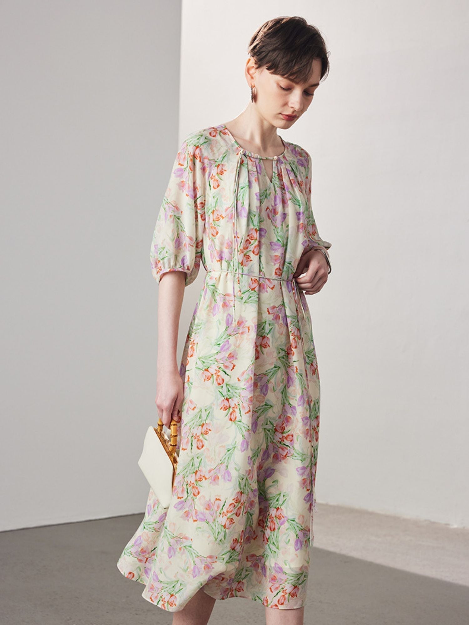 A woman wearing a floral dress.