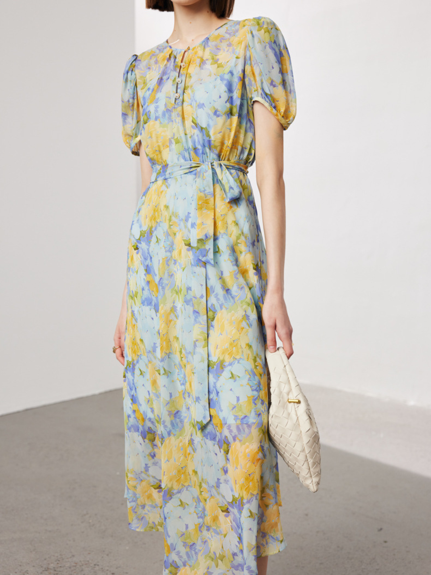 A woman wearing a floral dress.