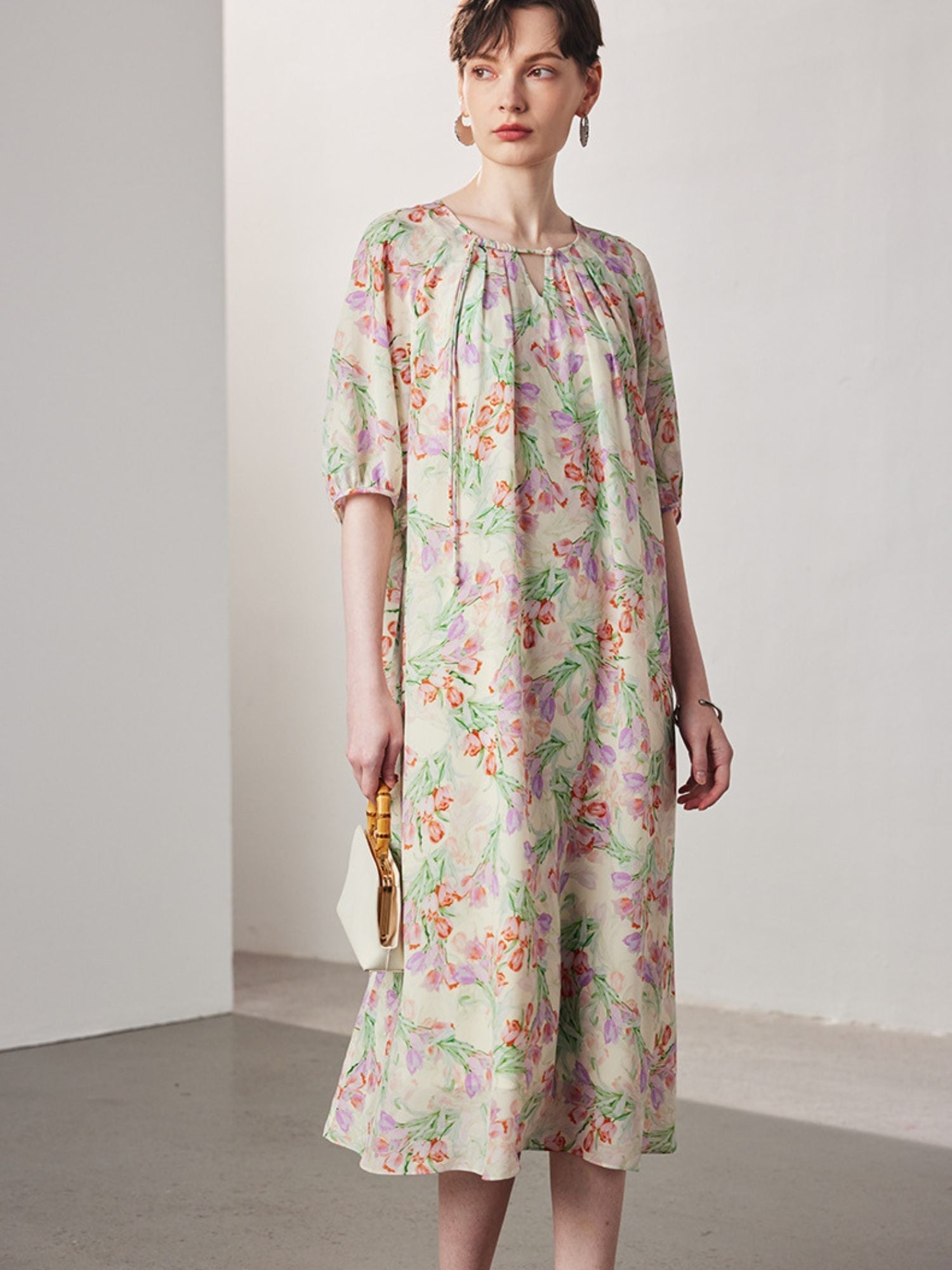 A woman wearing a floral dress.